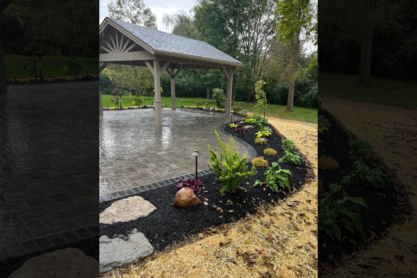 A pond with rocks and plants in the middle of it.